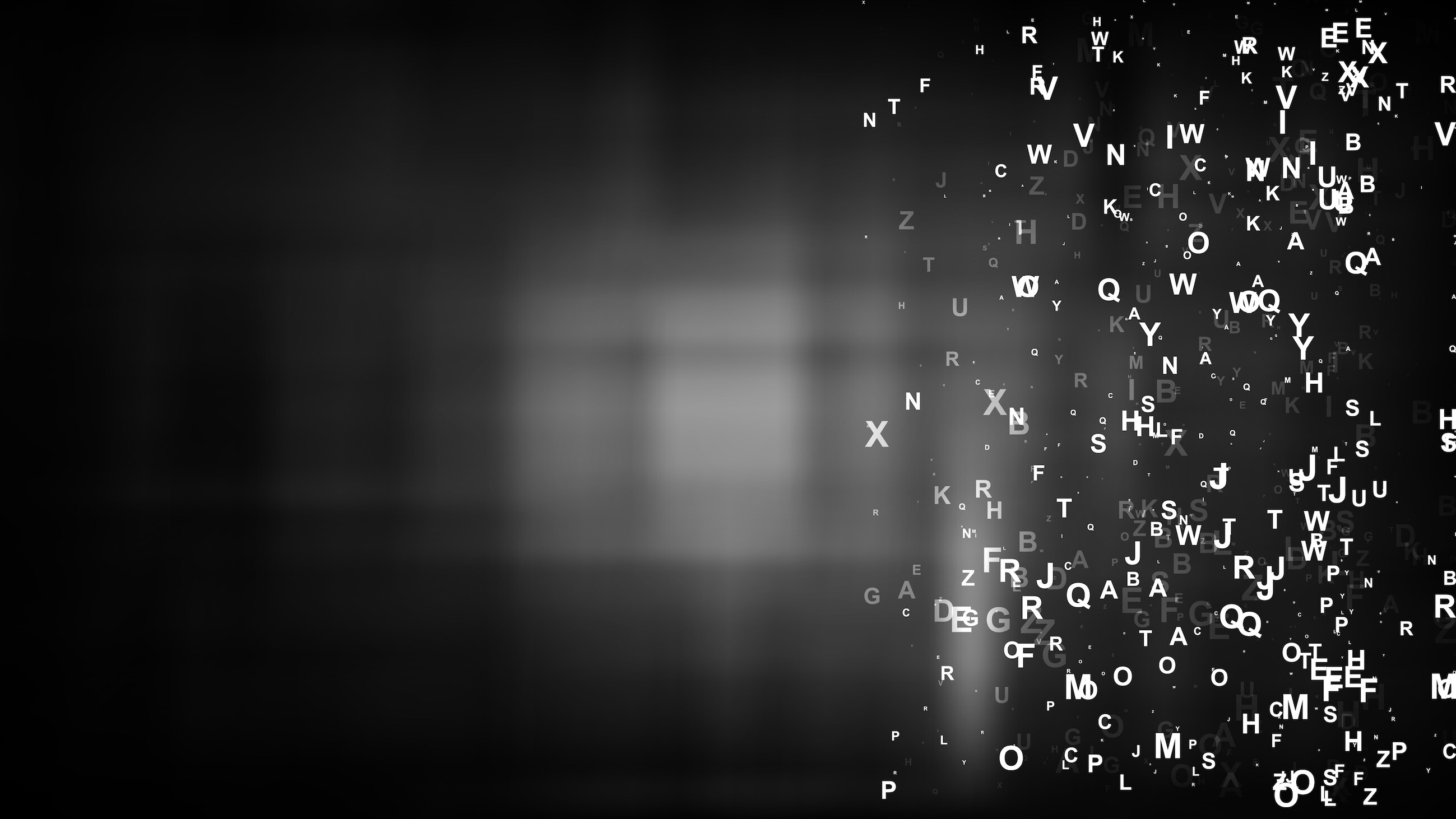 A picture of white letters scattered on a black background