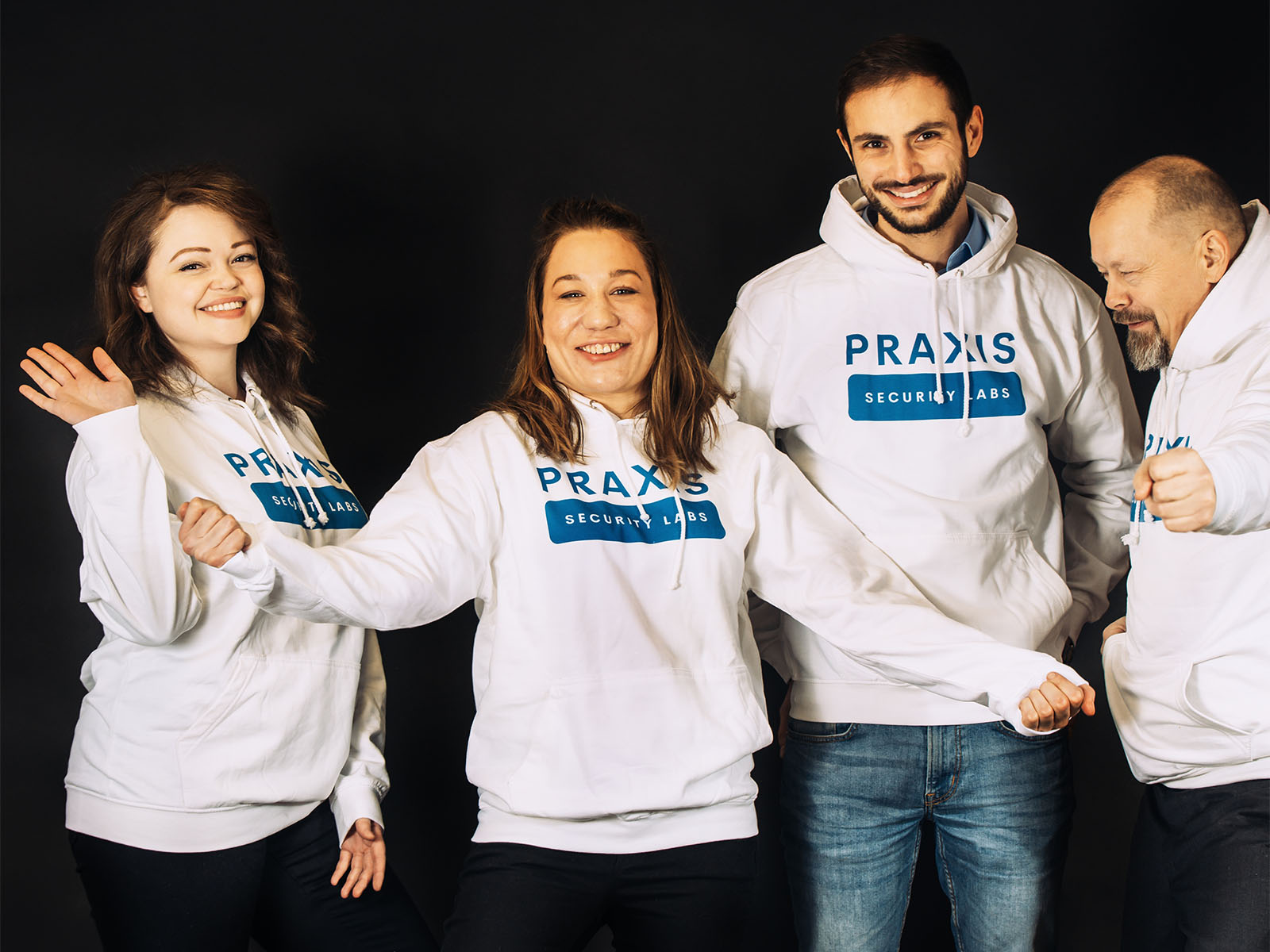 Group photo of Praxis Security Labs cofounders in matching hoodies, 2023